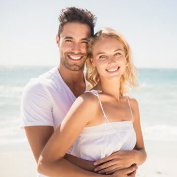 Smiling young couple hugging