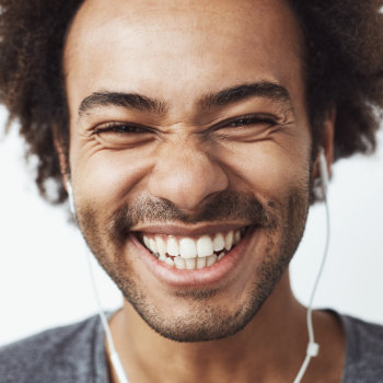 laughing african american listening to music